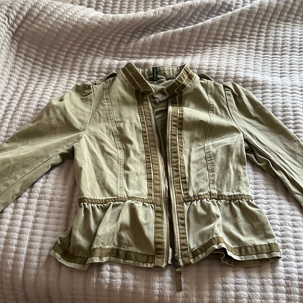 A light washed olive green zip up jacket. Lightly worn.
